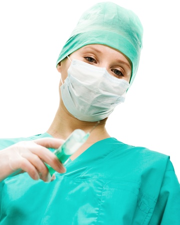 Surgeon woman with syringe making injection, on a white background.の写真素材