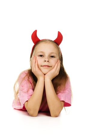 Young girl with horns imp on a white background.の写真素材