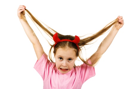 Young girl with horns imp on a white background.の写真素材