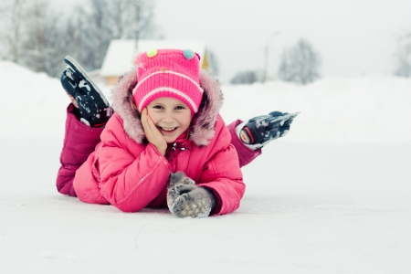 The girl in the skate on the ice.の写真素材