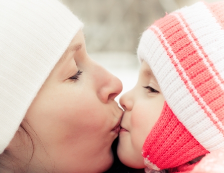 Women with baby in winterの写真素材