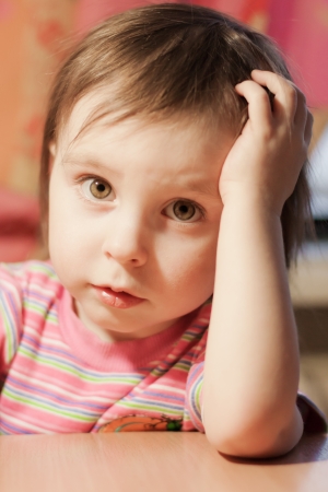 Little child smiles at the camera.の写真素材
