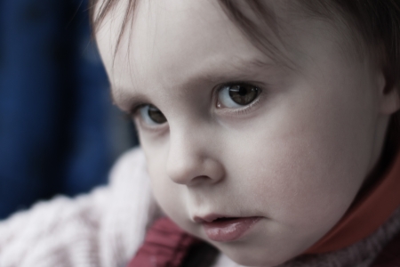 Portrait of sad child close-up.の写真素材
