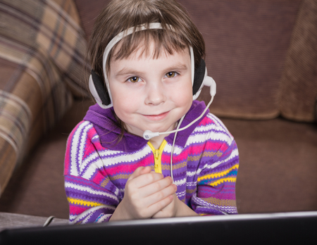 Girl Using a Laptop in the room.の写真素材
