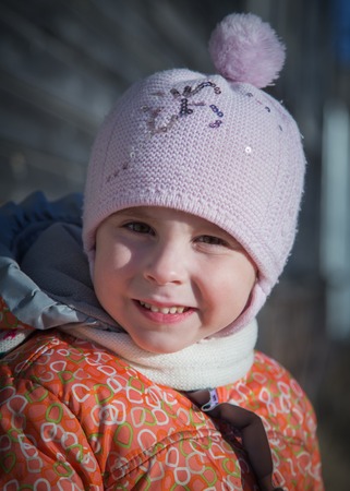 Portrait of little girl in winter clothesの写真素材