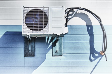 Air conditioning compressor on the wall of the building.の写真素材