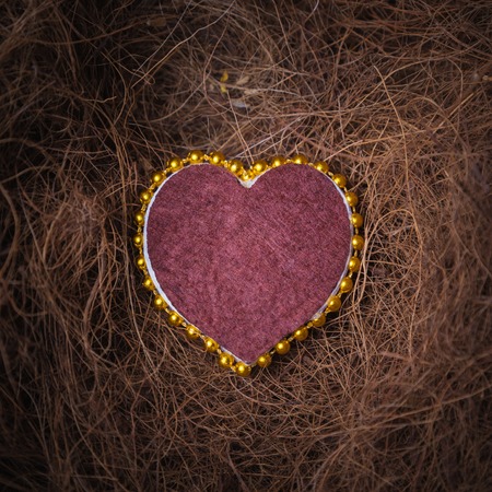 Valentine's day card with a straw in the form of heart.の写真素材
