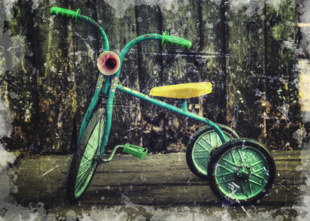Old retro bike in the house in the village. Photos in a grunge style.の写真素材