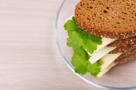 Bread with cheese and parsley on the table.