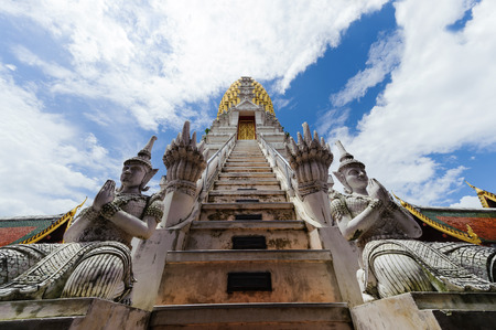 Angels and nagas guard a stairway to a main pagoda of Wat Phrasrimahathat, Pitsanulok, Thailandの写真素材