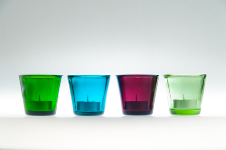 Multi-colored glass candle holders. Decorative glass candle jarsの写真素材