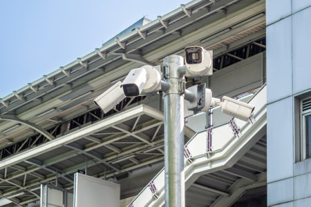 Multiple CCTV cameras mounted on post. Pole with different security cameras