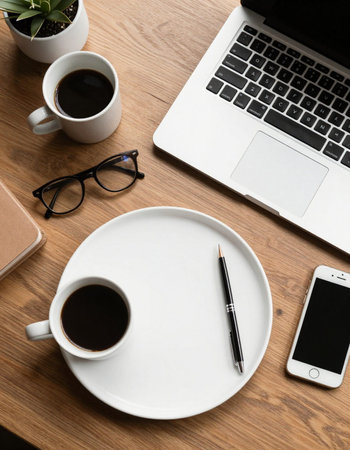 Workplace with laptop, cup of coffee and smartphone on wooden table