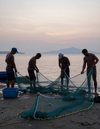 Fishermen at the beach in the early morning on the island of Langkawi in Malaysia.の写真素材