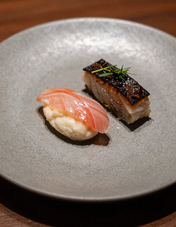 Japanese cuisine, nigiri sushi with salmon and eel on a plate