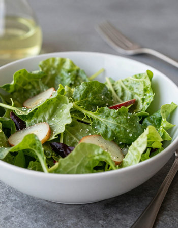 Fresh green salad with arugula, pears and sesame seedsの写真素材