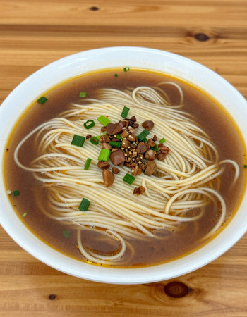 Japanese ramen noodle soup with green onions and sesame seeds