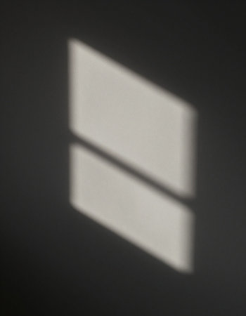 Shadow of the window on the wall. Shallow depth of field.