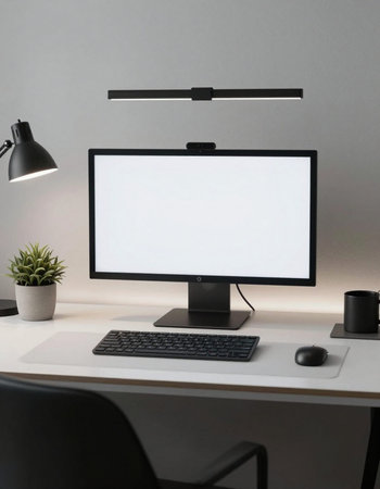 Computer with blank screen on desk in office. Mockup for design
