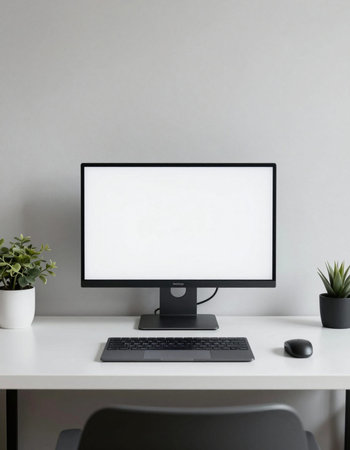 Mockup computer desktop with blank screen on white office desk.