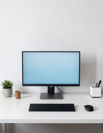 Modern desktop computer with blank screen on white office desk.の写真素材