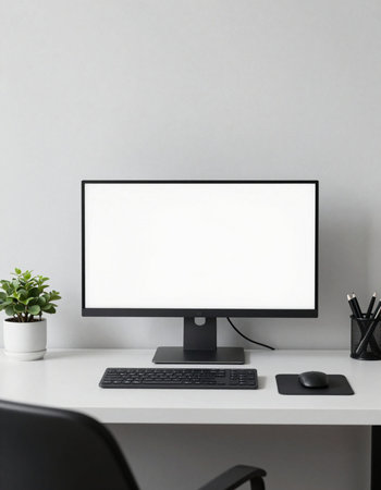 Modern workspace with blank screen computer, keyboard, mouse, stationery and plant. Mock up