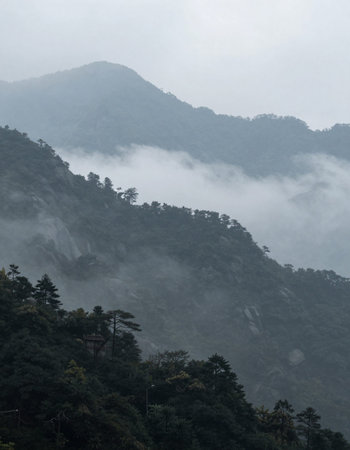 Mountain landscape with fog in Huangshan National Park, China.の写真素材