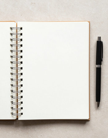 Notebook and pen on white background. Top view with copy spaceの写真素材