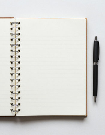 Notebook and pen on the white background with space for text.