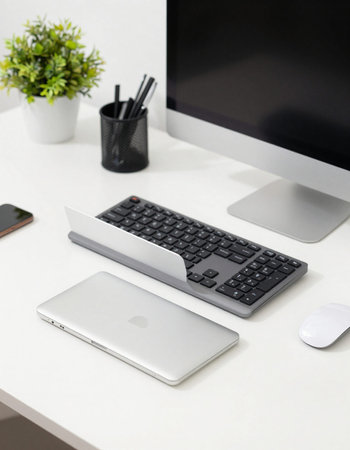 Office table with computer, mouse, keyboard, notebook and coffee cup