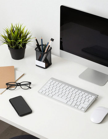 Office desk table with computer, supplies and coffee cup, stock photo