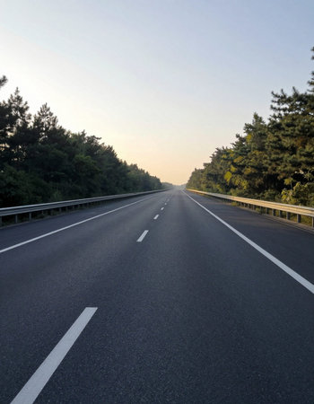 asphalt road with trees in the background, closeup of photoの写真素材