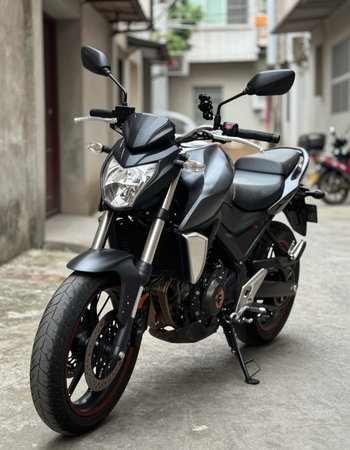 Black motorcycle parked in the street. Close-up of motorcycle.