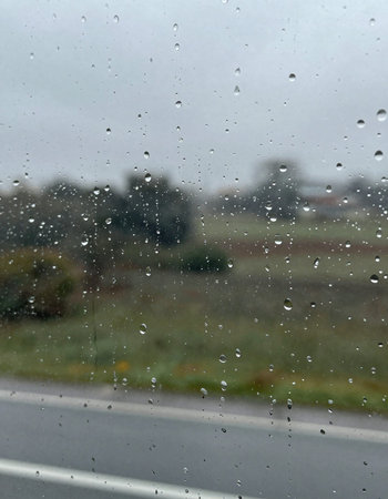Rain drops on the glass. Raindrops on the car window.