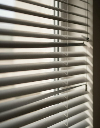 Blinds on the window in the morning. Selective focus.の写真素材