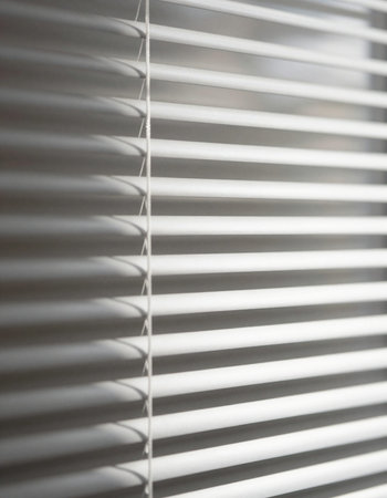 Blinds on the window in the morning light. Shallow DOFの写真素材