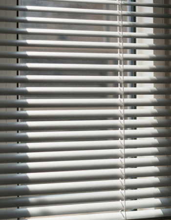 Blinds on the window. Horizontal blinds on the window.の写真素材