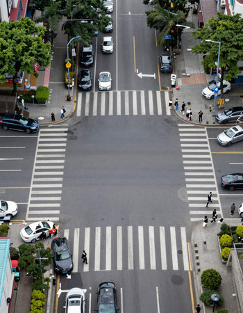 People crossing the road in Bangkok, Thailand.の写真素材
