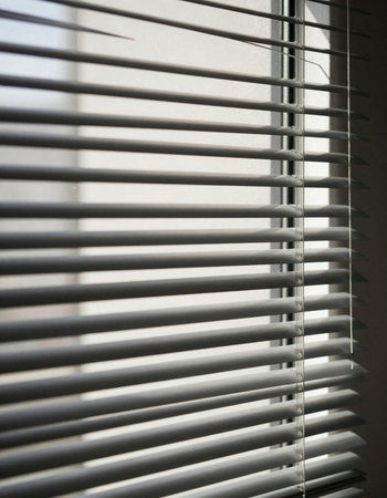 Blinds on the window in the morning. Selective focus.