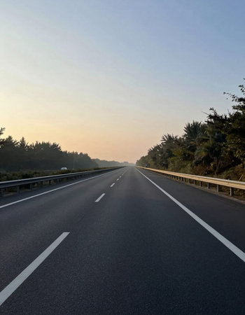 Asphalt road at sunset, closeup of photo