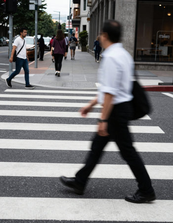 People walking in zebra crossing in Tokyo, Japan (motion blur)