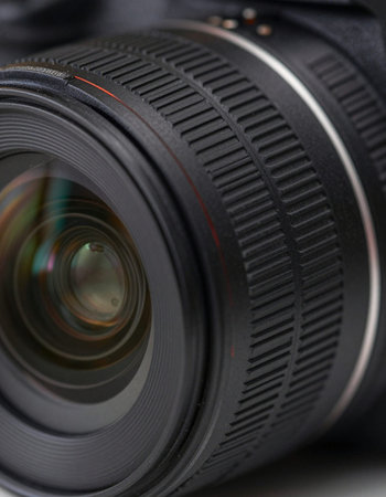 Close-up of a professional camera lens. Shallow depth of field