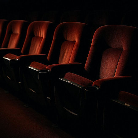 Cinema auditorium seats with red velvet seats. Cinema background