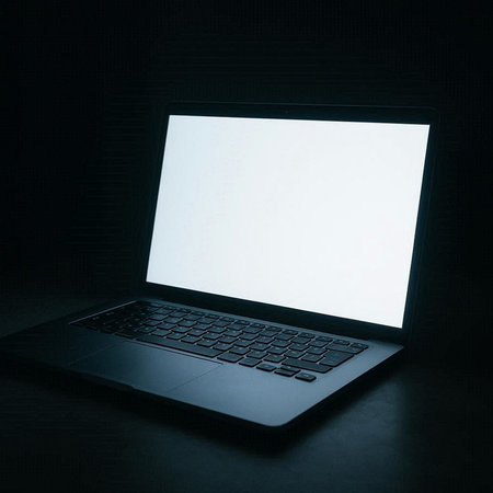Laptop with blank screen on black background. 3d rendering.の写真素材