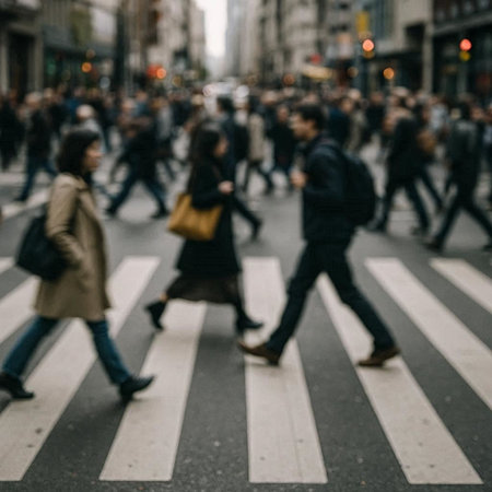 Blurred image of people crossing a street in New York City.