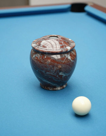 ball on a blue billiard table with copy space