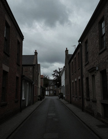 A view of a street in the centre of a town.