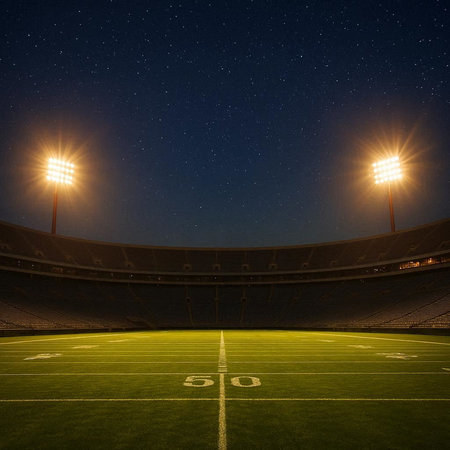 A football stadium at night with lights and space for your text.