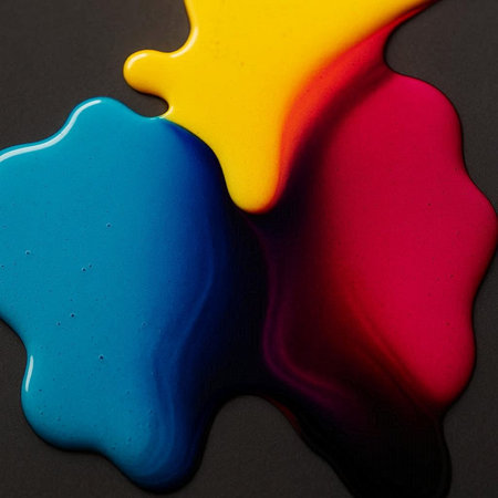 Colored paint splashes on a black background. Abstract background.の写真素材