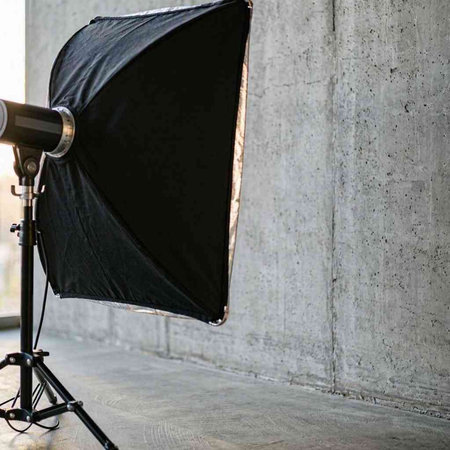 Photo studio equipment for making photos on the background of the concrete wall